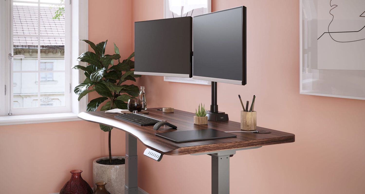 Workspace with a standing desk and accessories.