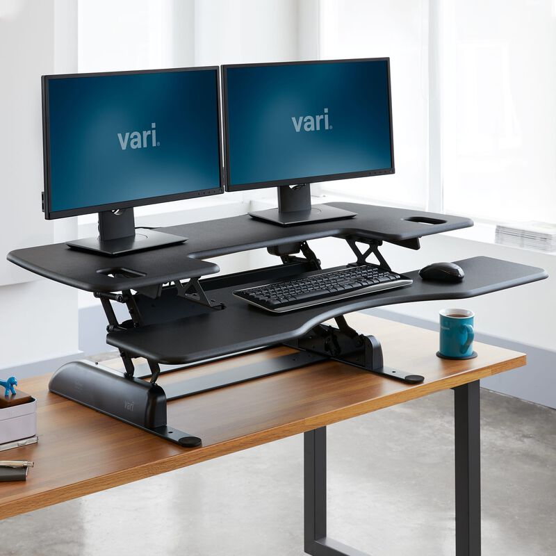 VariDesk® Pro Plus™ 48 Black in raised position at office image number null