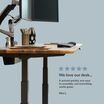 Front view of a electric standing desk with a five star rating with a customer review on the bottom of the image saying "We love our desk... It arrived quickly, was easy to assemble, and everything works great."