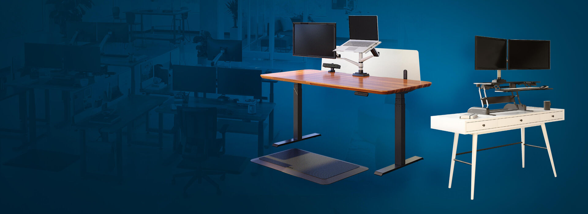 electric standing desk in raised position next to a varidesk converter ontop of white desk