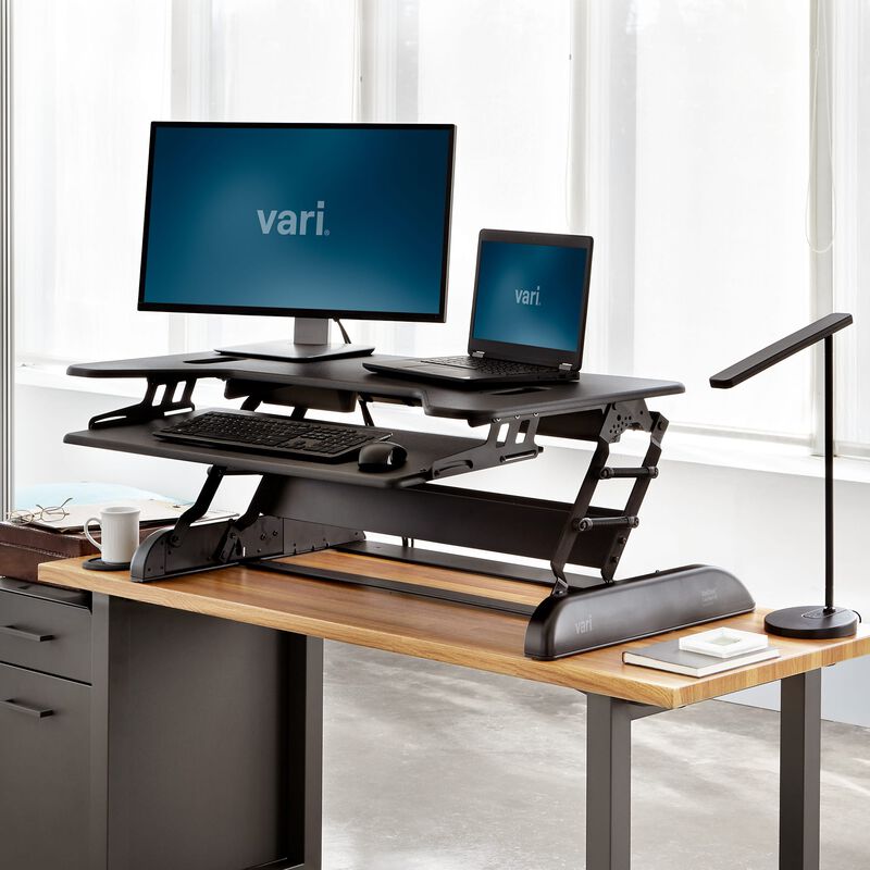 VariDesk® Cube Plus® 40 Black in raised position at office image number null